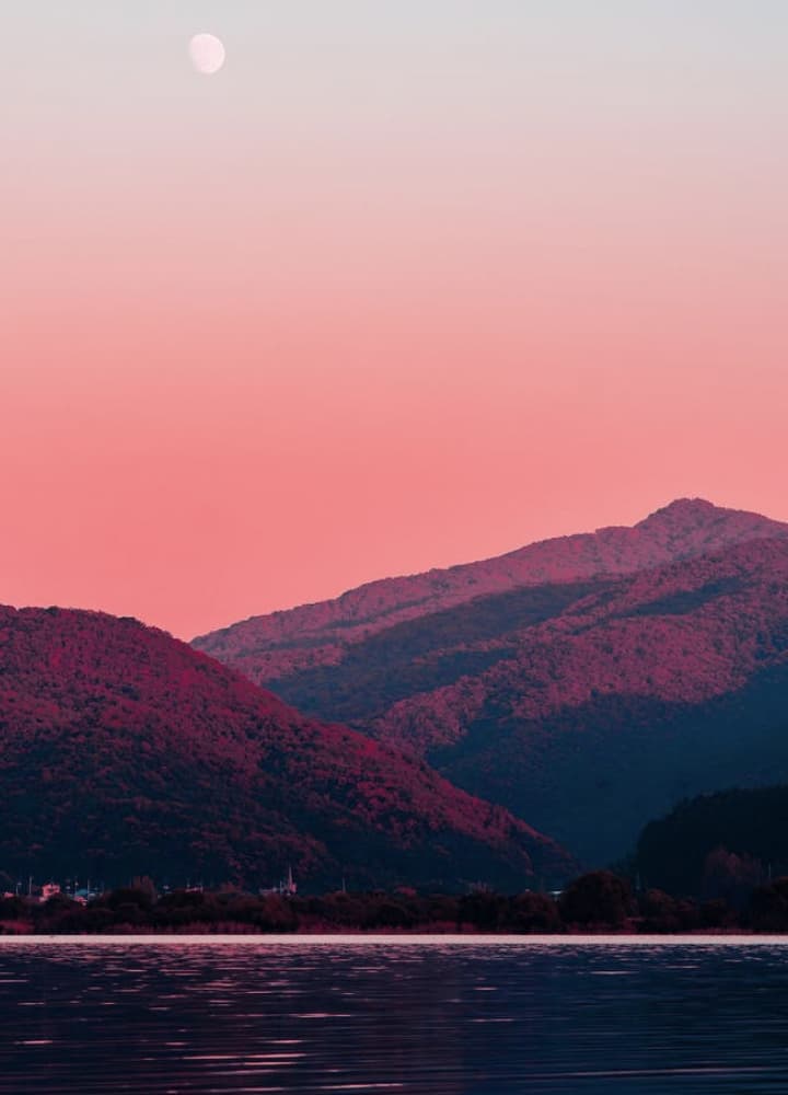 lake with mountain range in the background