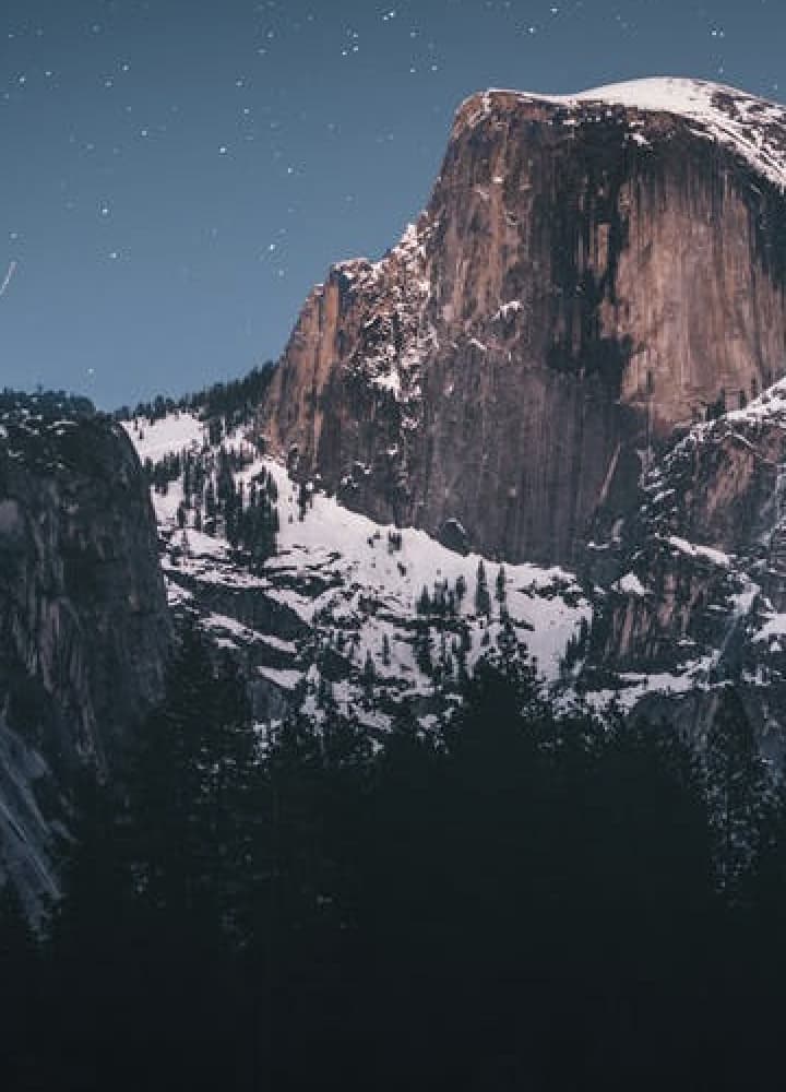 mountain range with night sky in the background