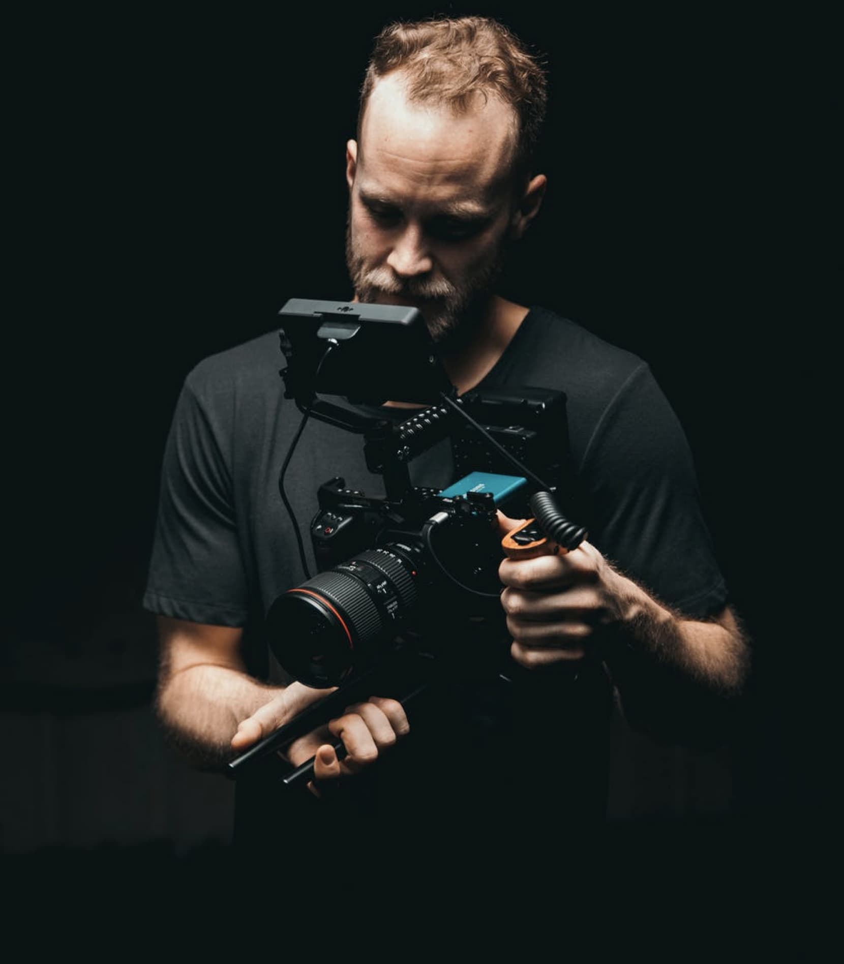 man holding a digital cinema camera