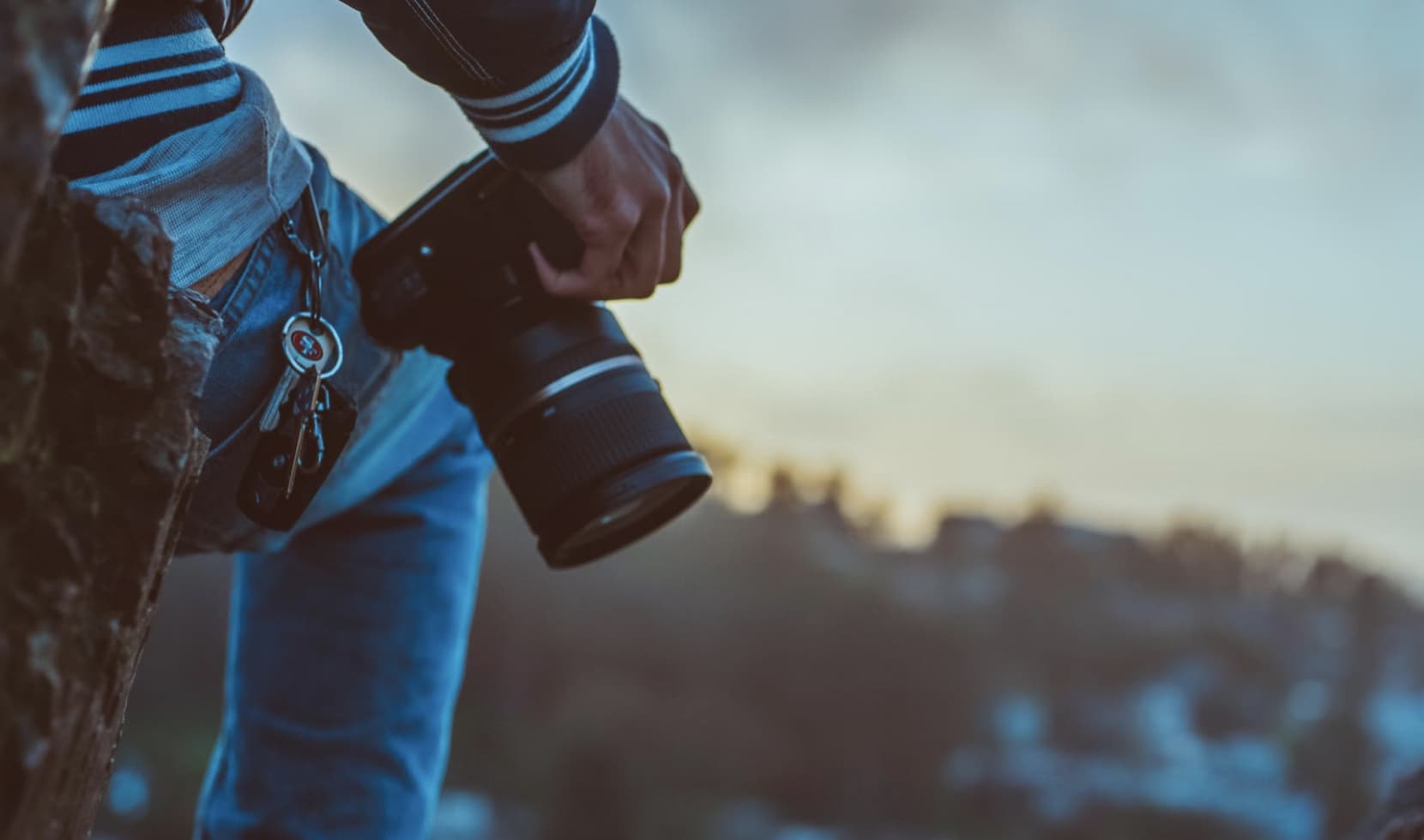 close up of a hand holding a digital photography camera