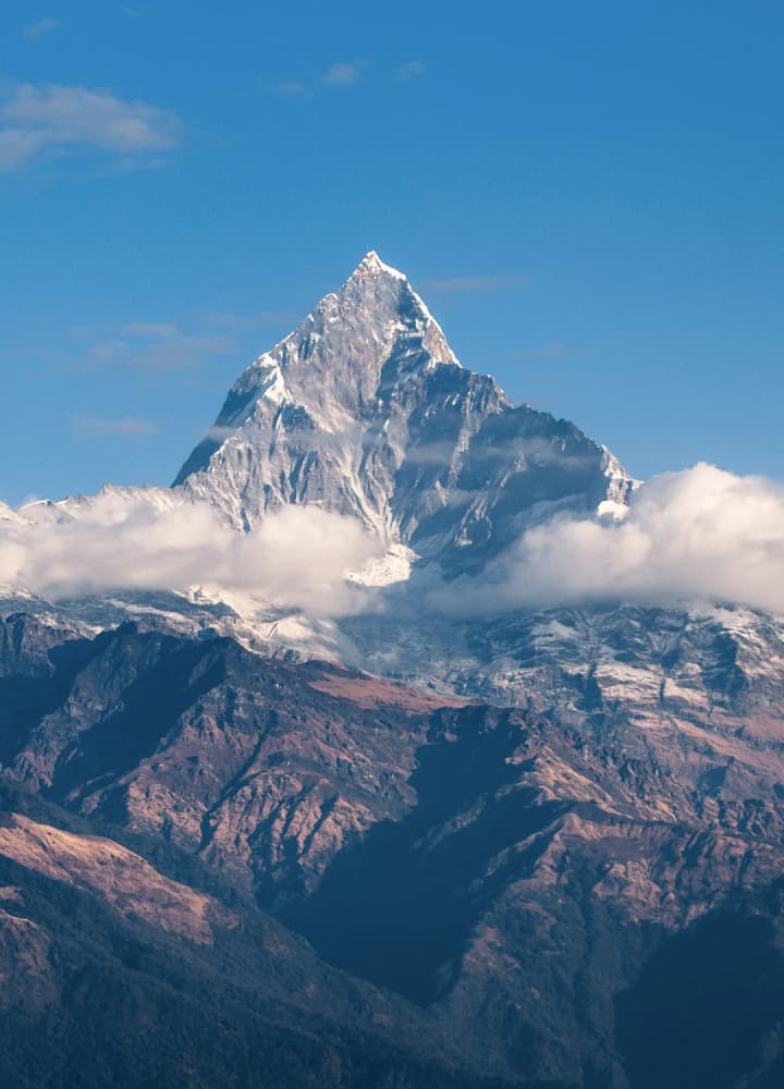 mountain peacing through the clouds